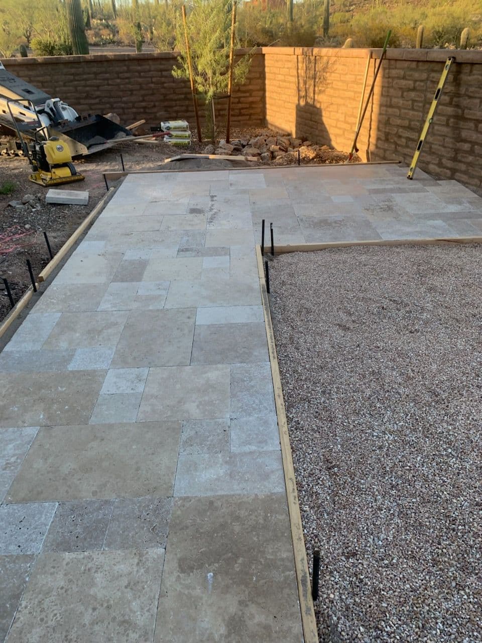 Beautiful Travertine and Gravel Patio Installation image